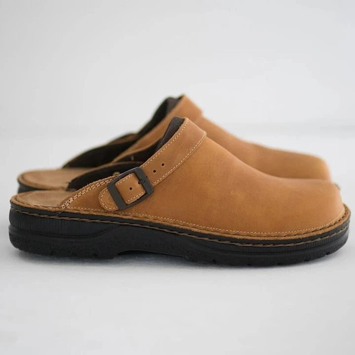 Women's faux leather slide with adjustable buckle strap and cushioned comfort footbed Mune Fashion