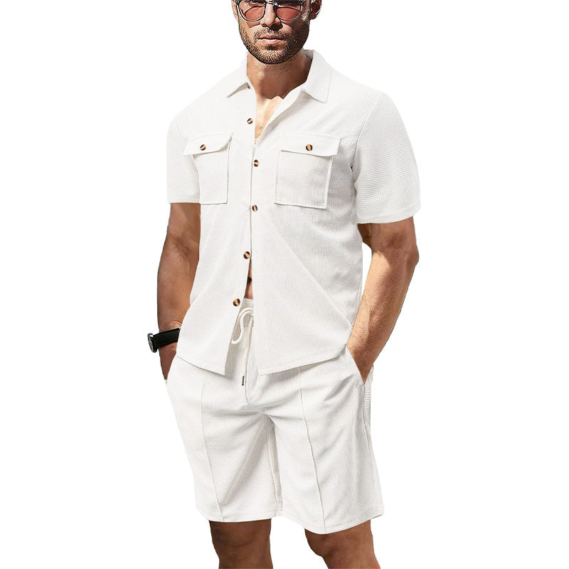 Men's modern short-sleeve shirt set in resort style with patch pockets, open lapel collar, and drawstring Bermuda shorts made of textured jersey Mune Fashion