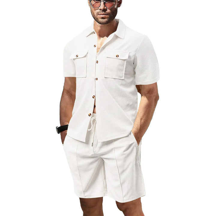 Men's modern short-sleeve shirt set in resort style with patch pockets, open lapel collar, and drawstring Bermuda shorts made of textured jersey Mune Fashion