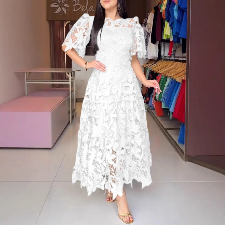 Women's maxi dress made of floral guipure lace with a fitted silhouette and tiered hem Mune Fashion
