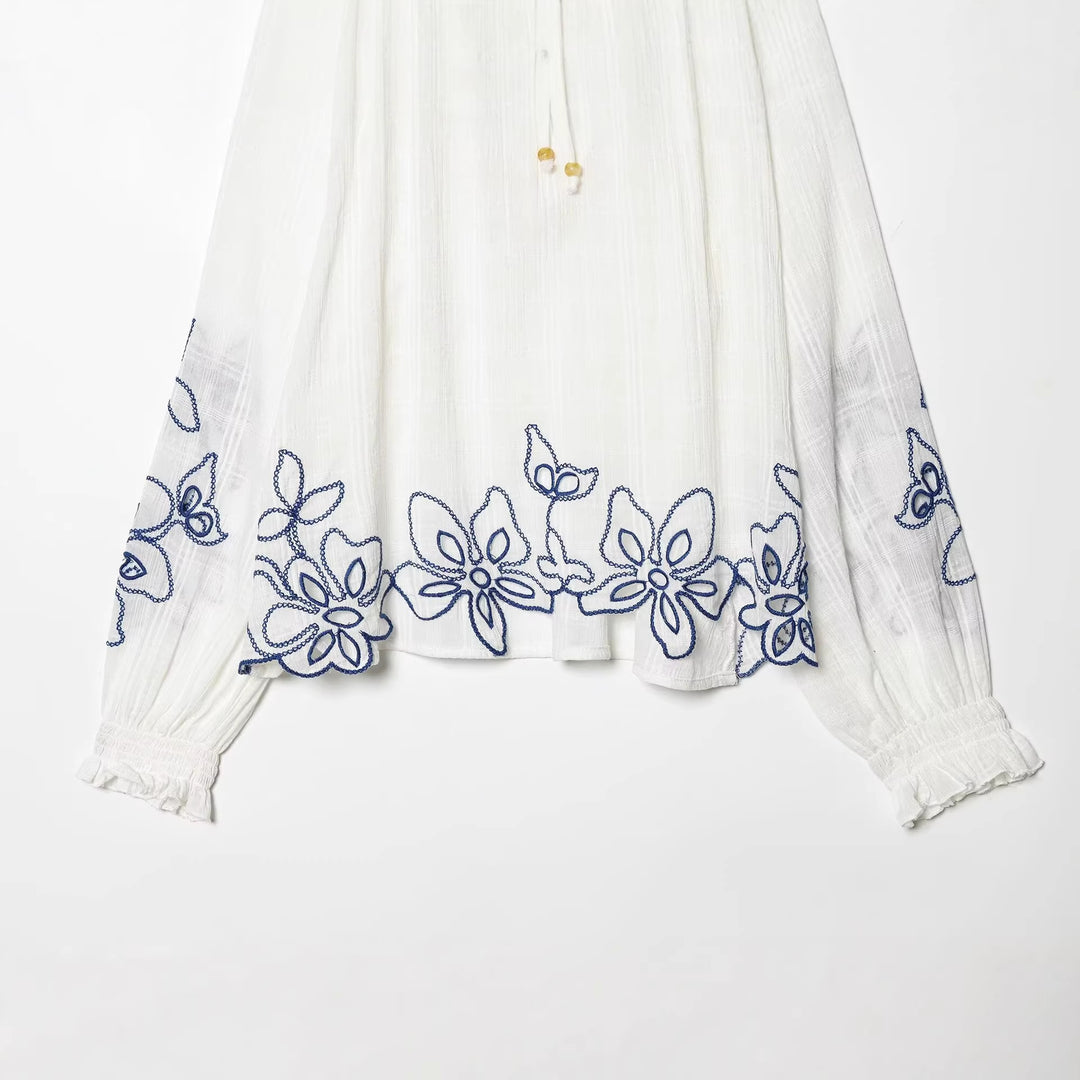 Women's embroidered cotton tunic with ruffle collar, smocking details and tie band