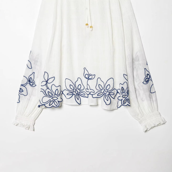 Women's embroidered cotton tunic with ruffle collar, smocking details and tie band