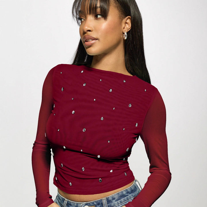 Women's fitted mesh top with rhinestone applications and boat neck Mune Fashion