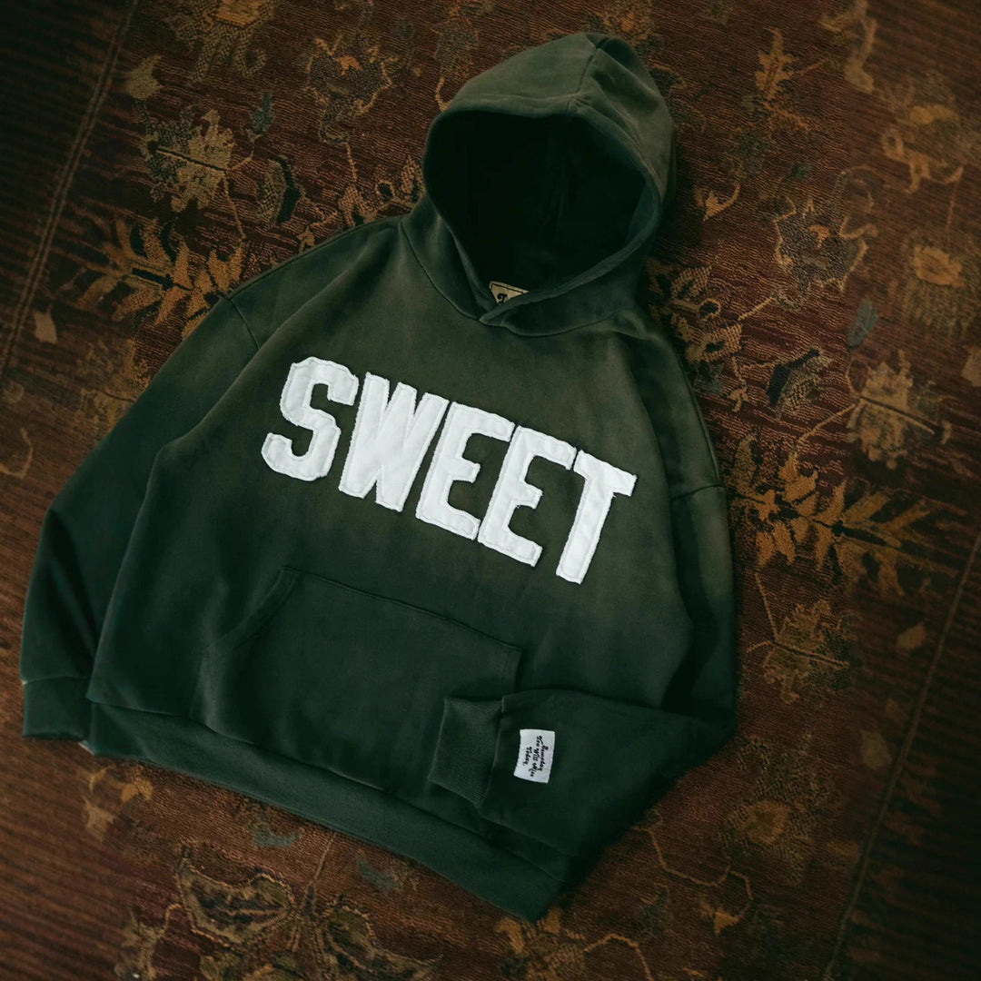 Unisex nan oversized hoodie with appliquéd letter patches and kangaroo pocket Mune Fashion
