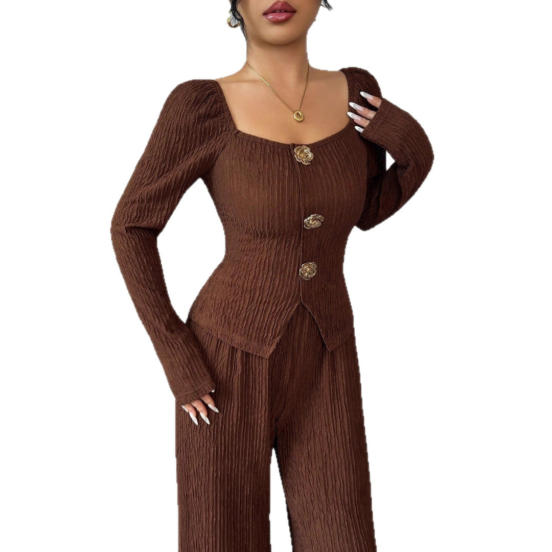 Women's tailored blouse and pants set made of crinkle pleats with puff sleeves and decorative buttons Mune Fashion