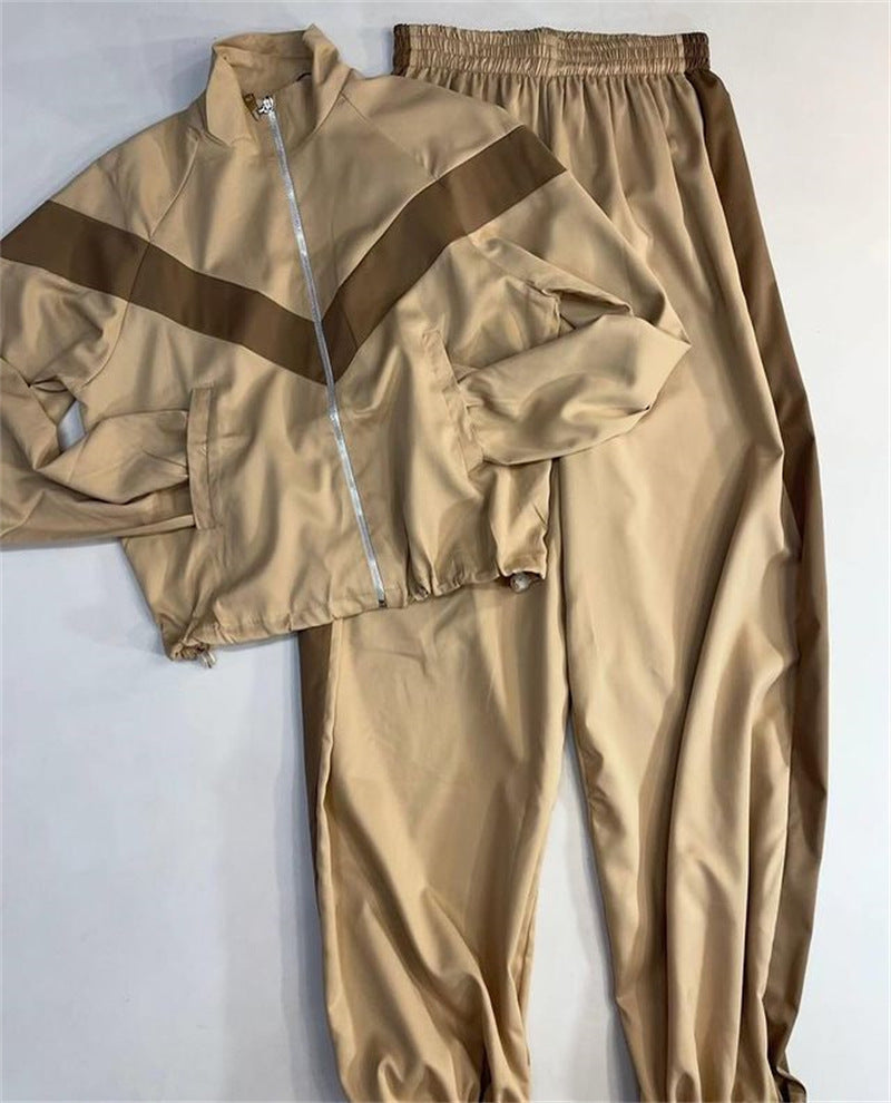 Women's tailored zip training set with chevron insert, drawstring hem, and high-cut jogging pants Mune Fashion
