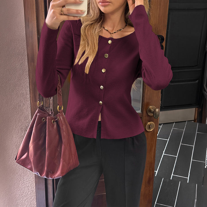 Women’s fitted fine knit cardigan with asymmetrical gold button placket and front slit Mune Fashion