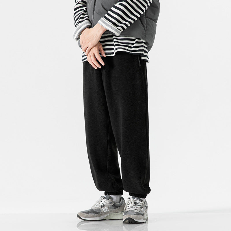 Men's wide-cut fleece jogging pants with elastic cuffs and side pockets Mune Fashion