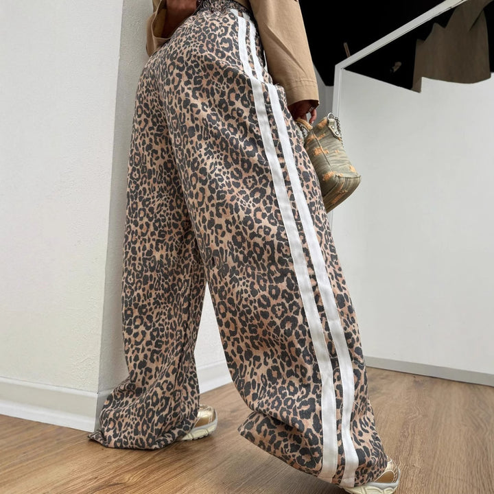 Ladies wide leopard track pants with elastic waistband and side contrast stripes Mune Fashion