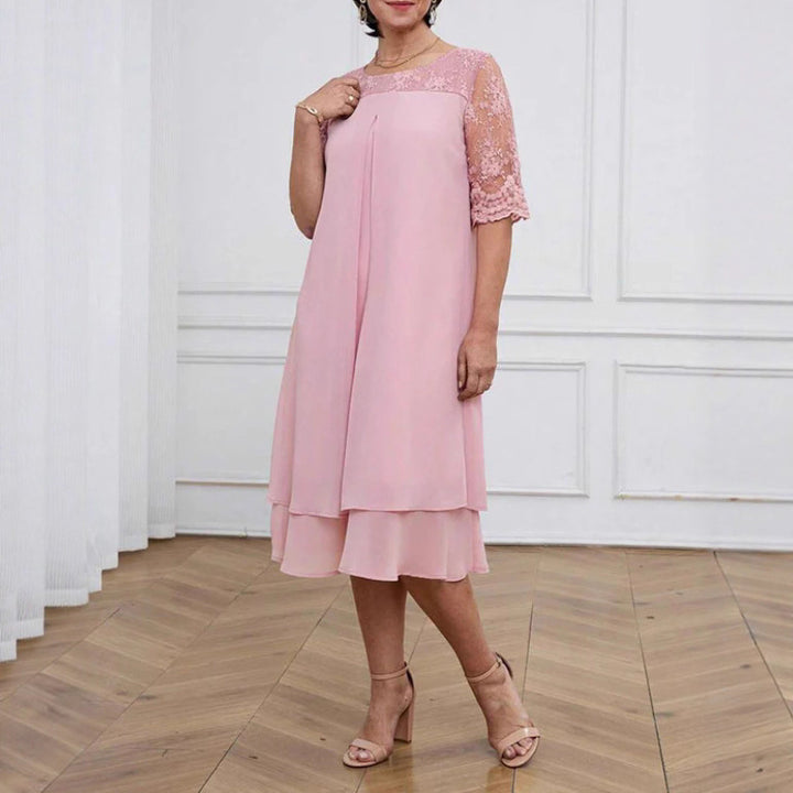 Women's A-line chiffon dress with floral embroidered lace yoke, hidden centre seam pleat, and layered ruffle Mune Fashion