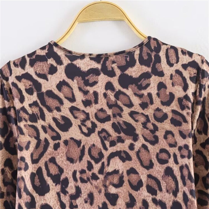 Women’s leopard print mini dress with round neckline, long sleeves, and A-line silhouette Mune Fashion