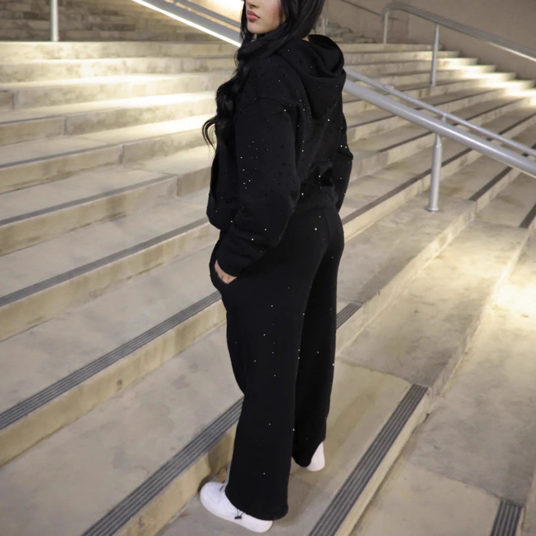Women's wide sweatpants with all-over stars, Gothic logo print, elastic waistband, and side pockets Mune Fashion