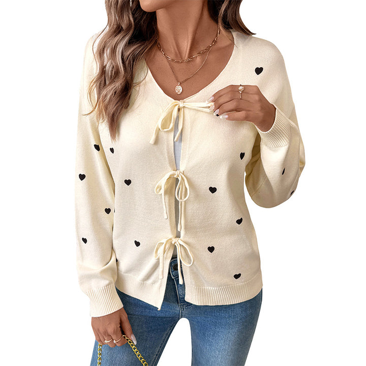 Women's fine knit cardigan with decorative bow closures and heart motif Mune Fashion
