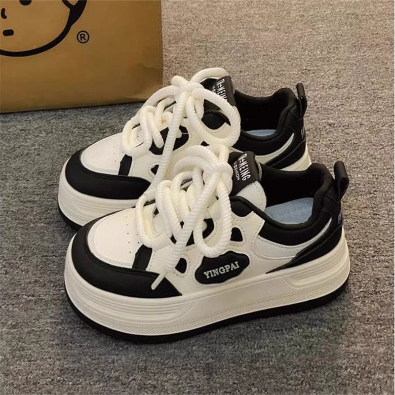 Women's lace-up sneakers with modern design elements and cushioning sole Mune Fashion
