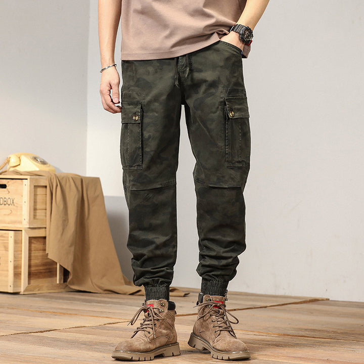Men's tactical cargo jogger pants in camouflage look with drawstring waistband, reinforced knees, and cuffed hems Mune Fashion
