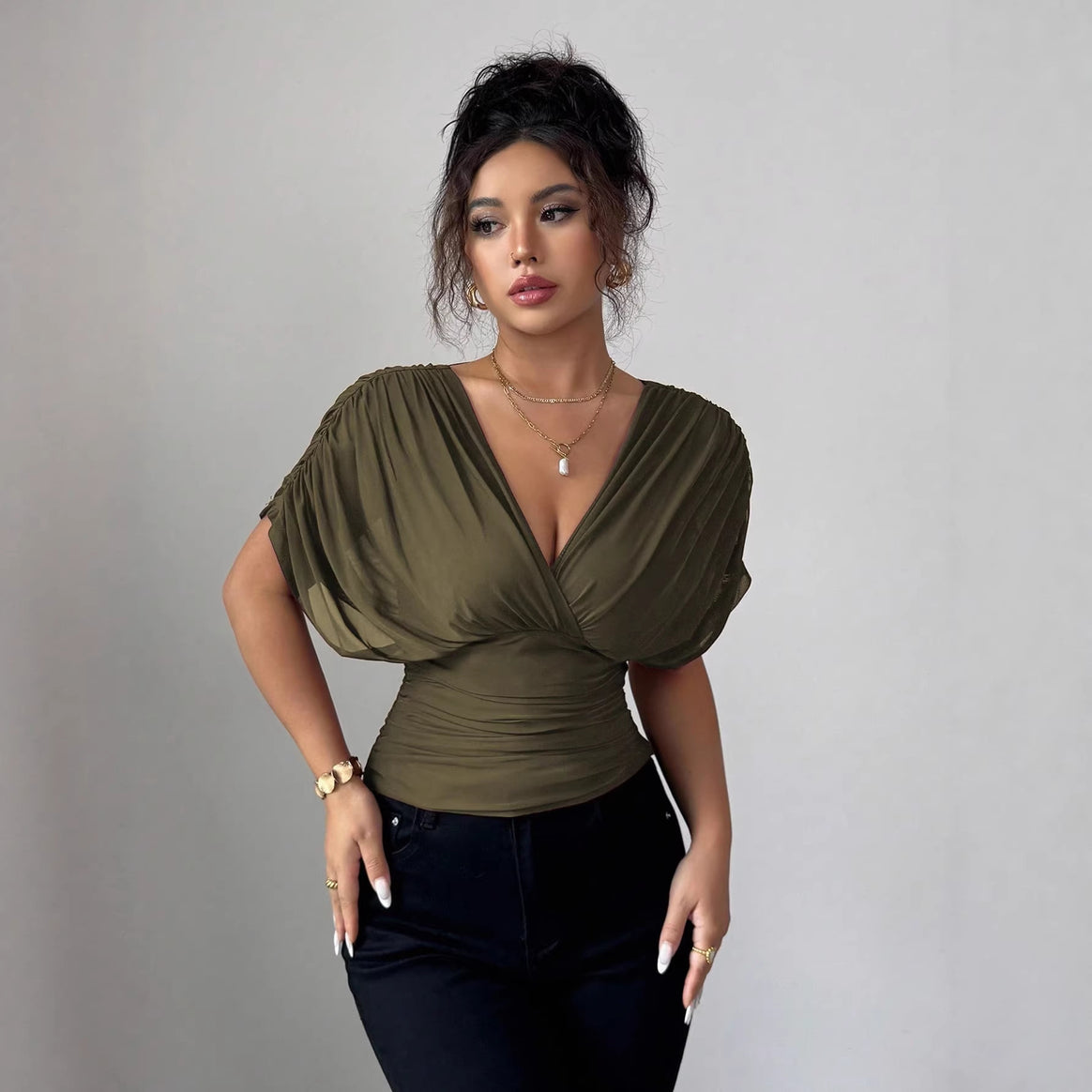 Women's fitted wrap top with deep V-neck and gathered wing sleeves Mune Fashion