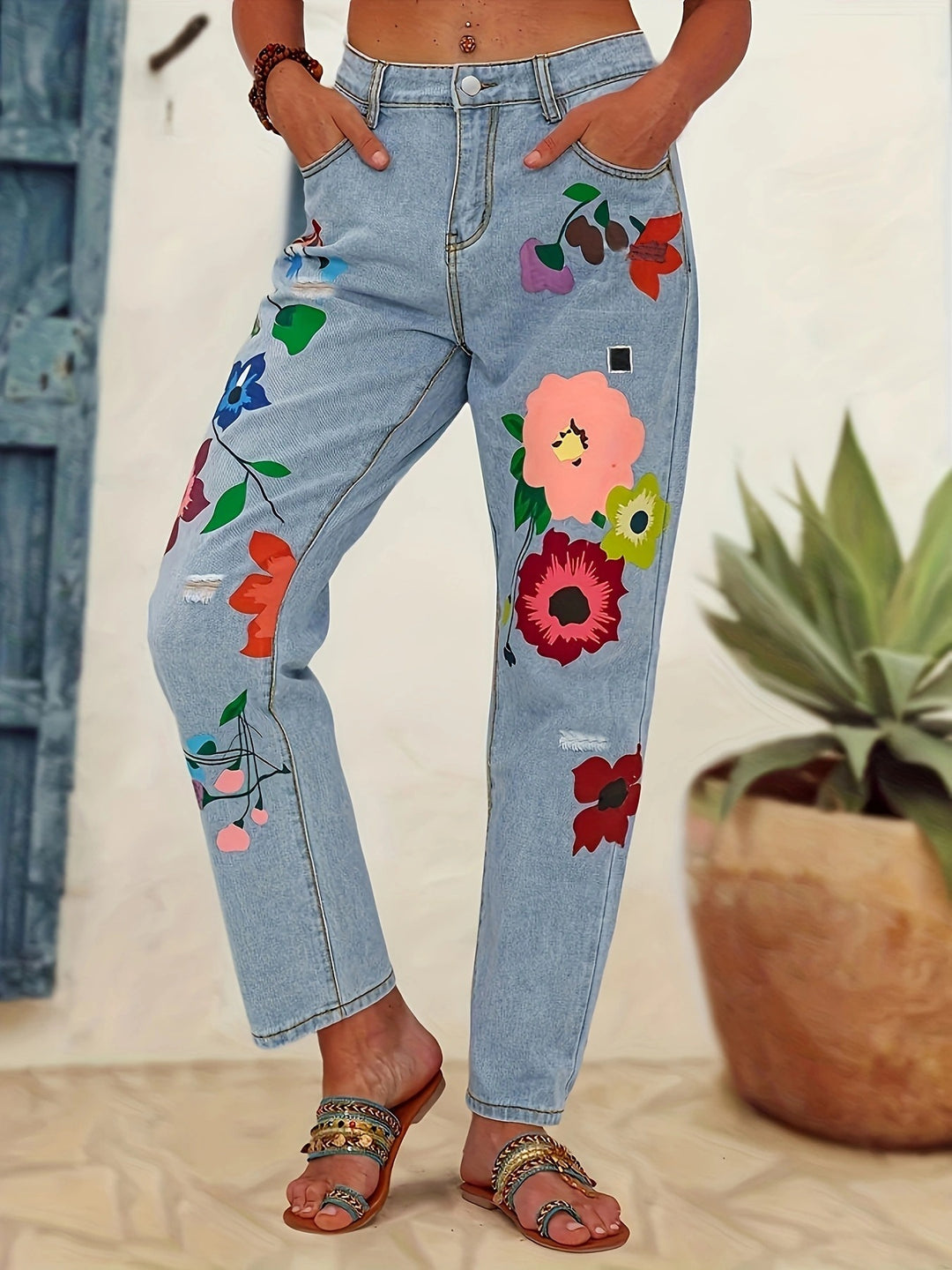 Ladies straight-cut jeans with colorful floral appliqués and light destruction details Mune Fashion