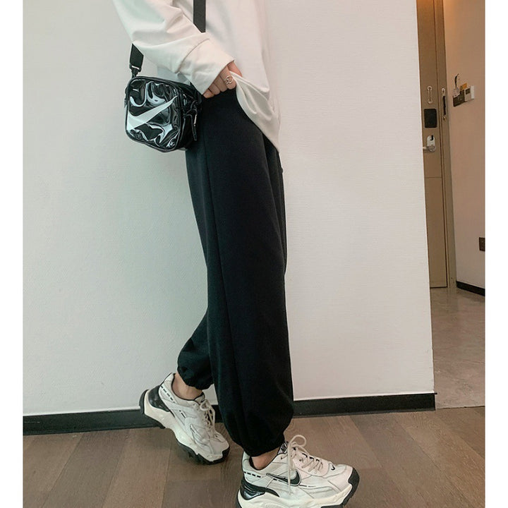 Women's relaxed-fit sweatpants with elastic drawstring waistband, side pockets, and stitched hem seams Mune Fashion