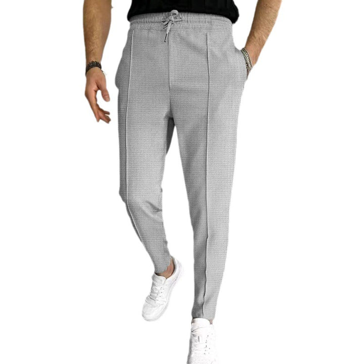 Men's patterned jogging pants with elastic drawstring, shaping crease, and tapered leg Mune Fashion
