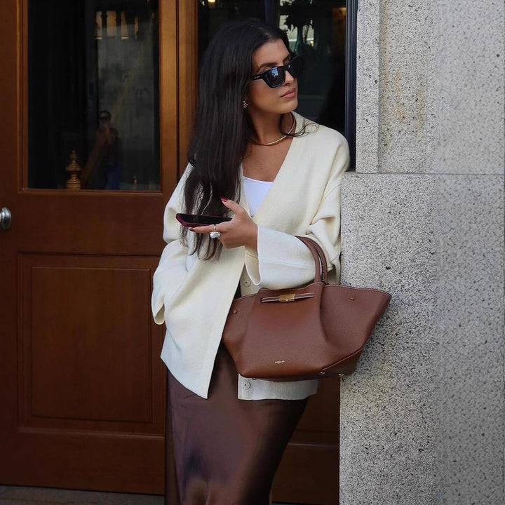 Women's chunky knit cardigan with deep V-neckline, boxy oversized silhouette and patch pockets Mune Fashion