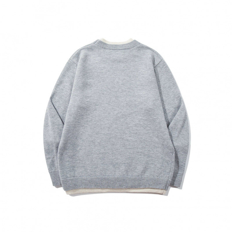 Unisex fine knit sweater with raglan seam and triangular hem adornment Mune Fashion