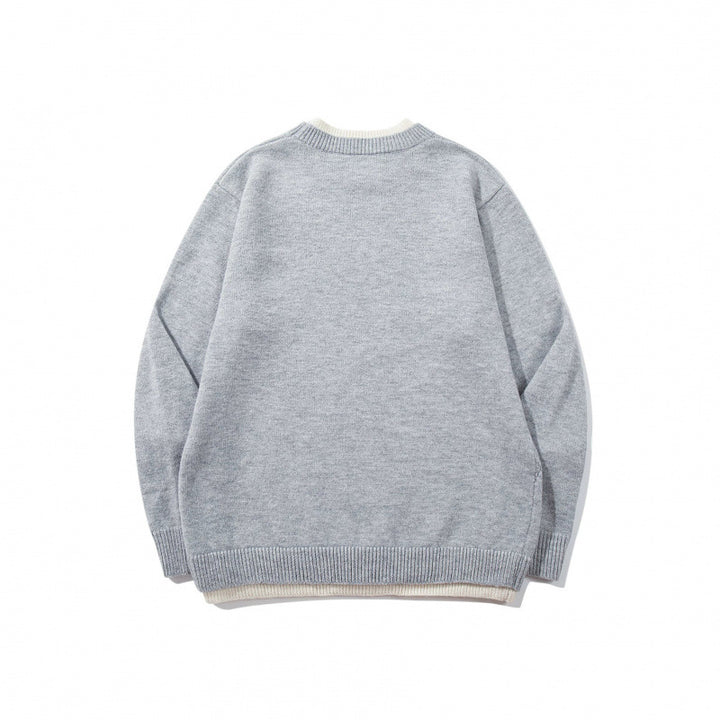Unisex fine knit sweater with raglan seam and triangular hem adornment Mune Fashion