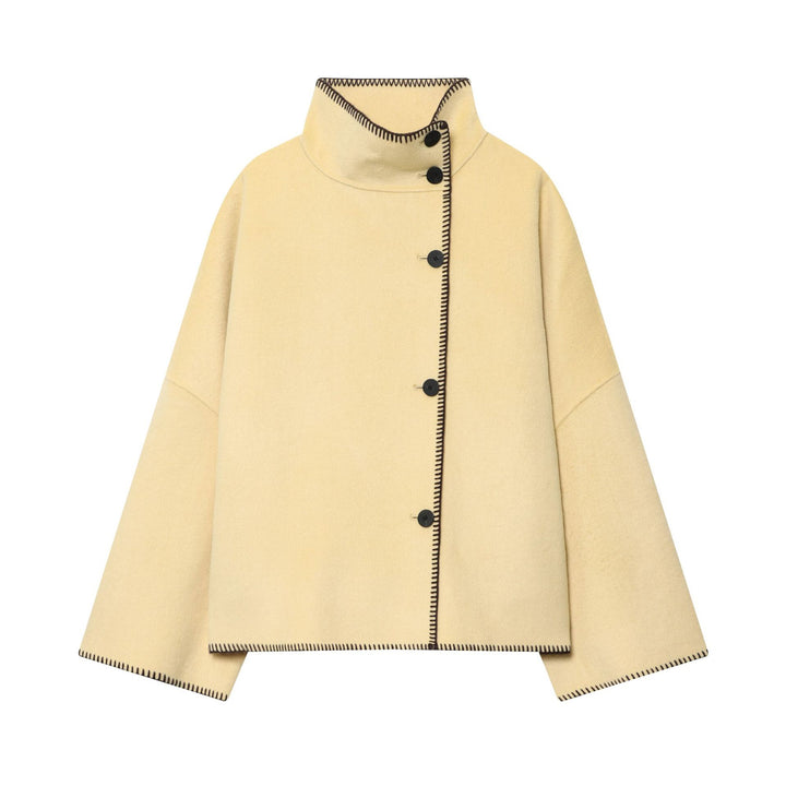 Women's cape coat with stand-up collar, asymmetric button placket and decorative seam Mune Fashion