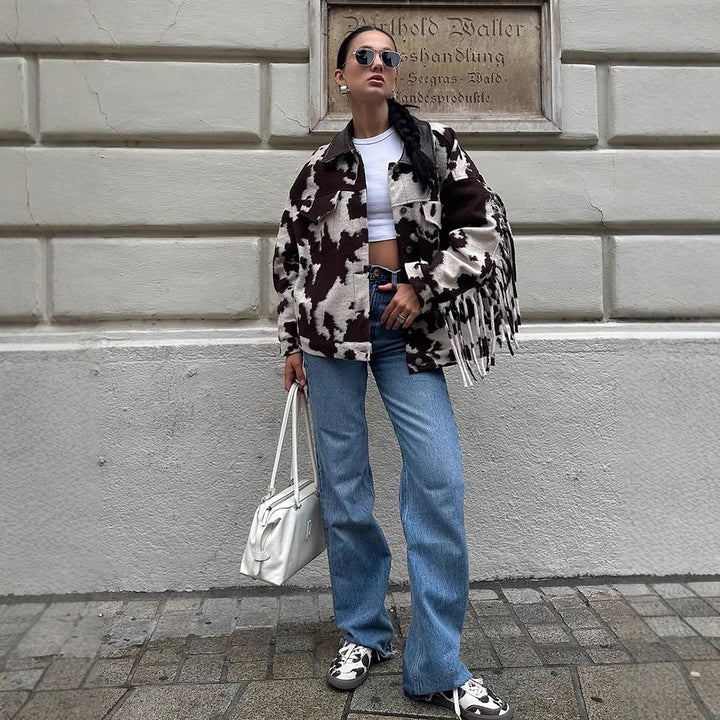 Ladies short jacket in cow print with fringes, faux fur look and leather collar Mune Fashion