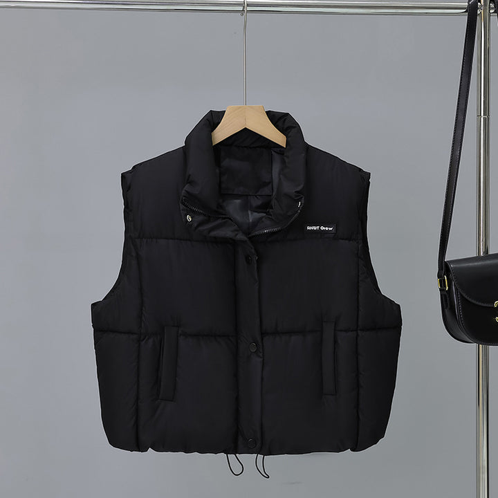 Women's short cut thermo quilted vest with high stand-up collar, snap button front and adjustable drawstring hem Mune Fashion