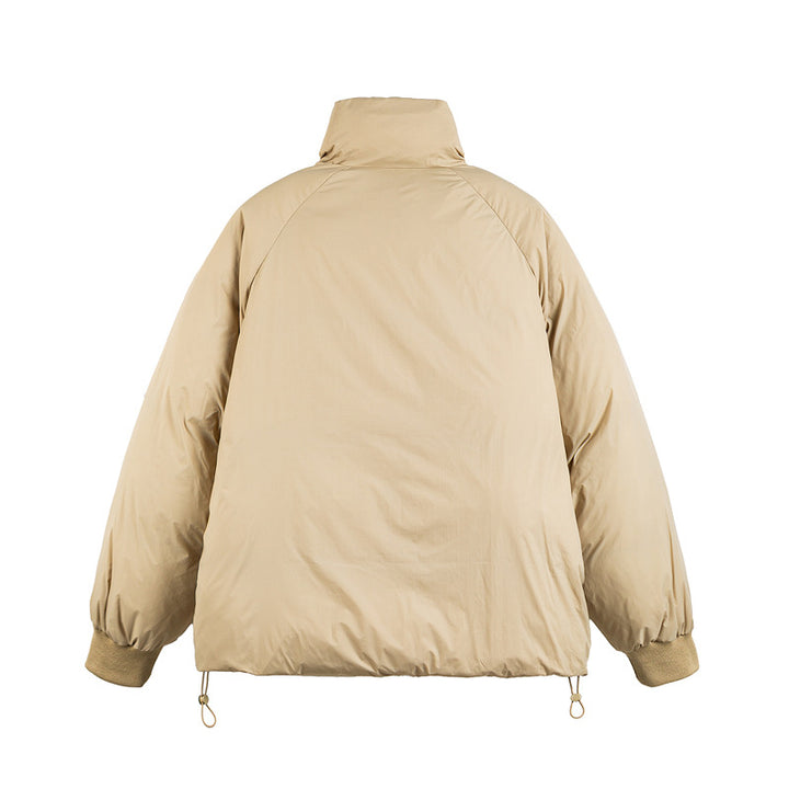 Unisex Boxy-padded short jacket with high stand-up collar, raglan sleeves and drawstring hem Mune Fashion