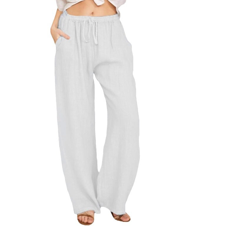 Women's airy palazzo pants with drawstring waistband, elastic waist finish, and side pockets Mune Fashion