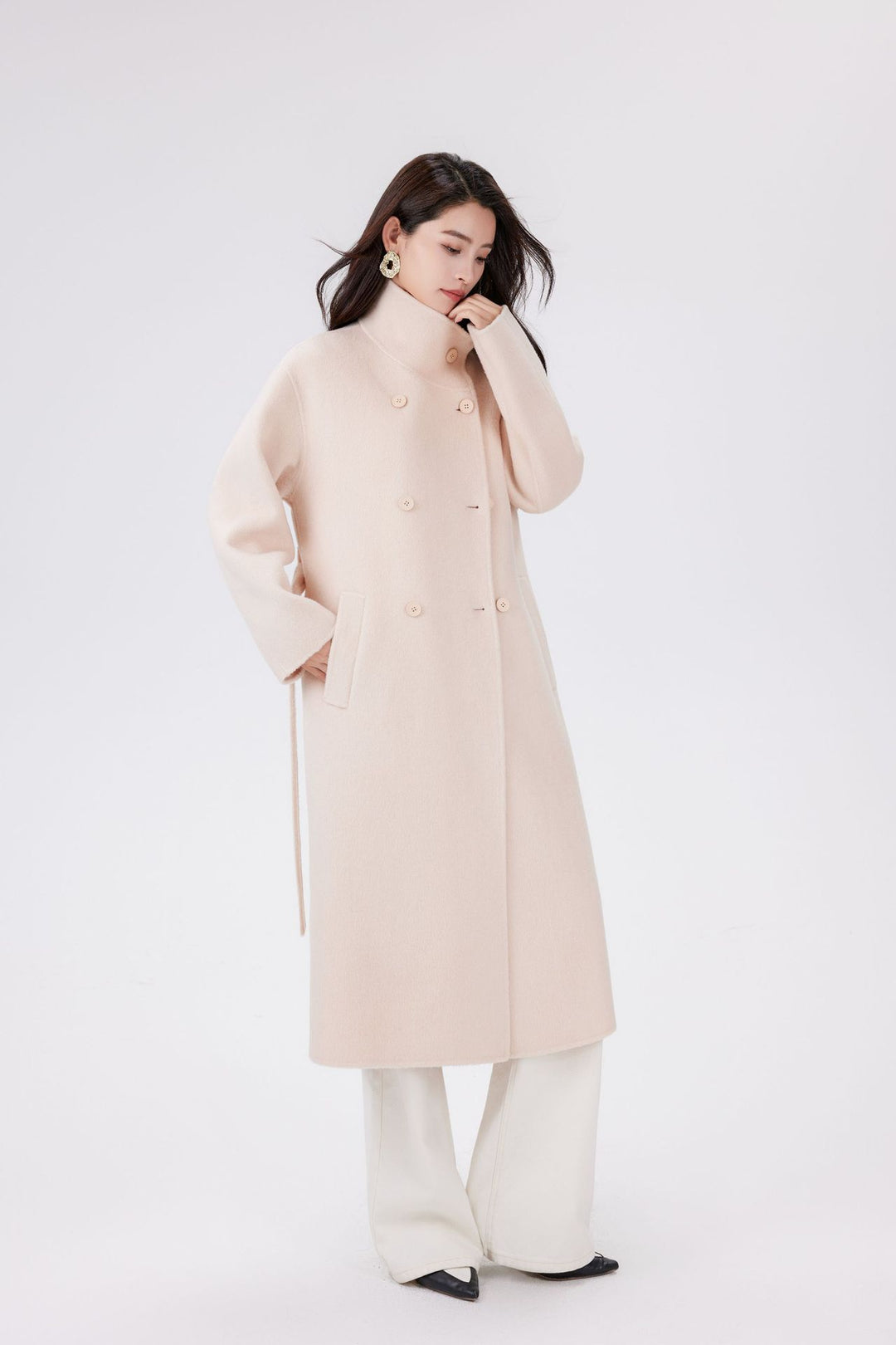 Women’s wool coat with double-breasted button placket, waist belt, and stand-up collar Mune Fashion