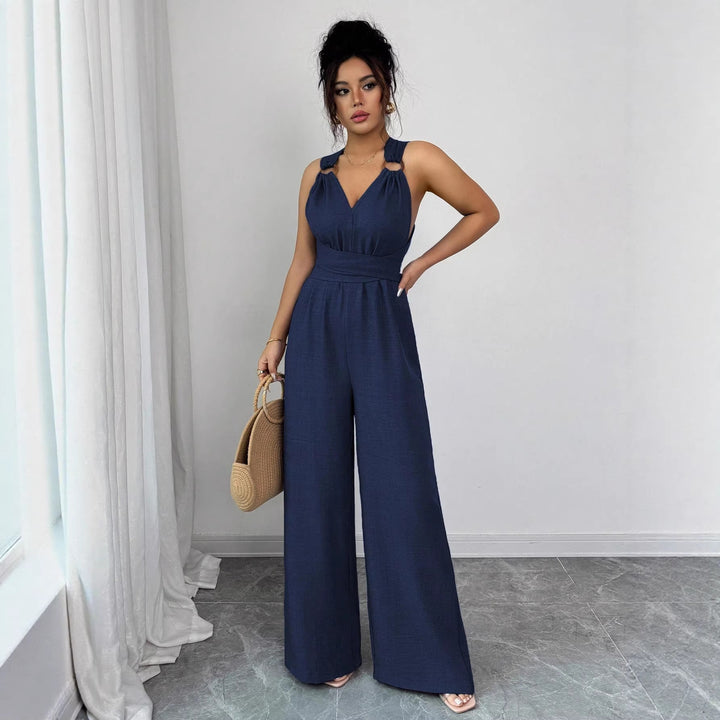 Women’s jumpsuit with wide leg, tailored wrap belt and eyelet straps Mune Fashion
