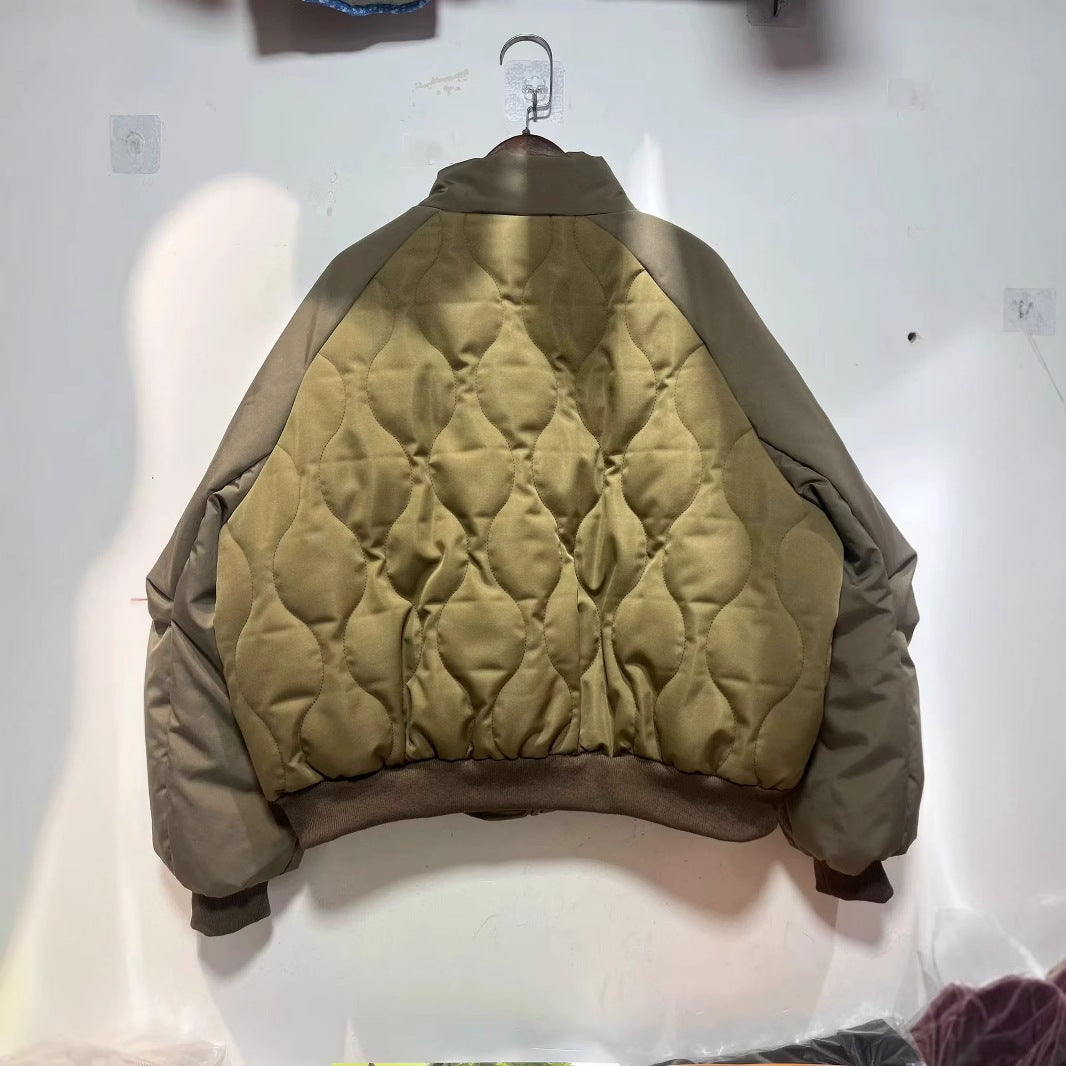 Women's quilted bomber jacket with high stand-up collar, lightweight thermal padding, and ribbed cuffs Mune Fashion