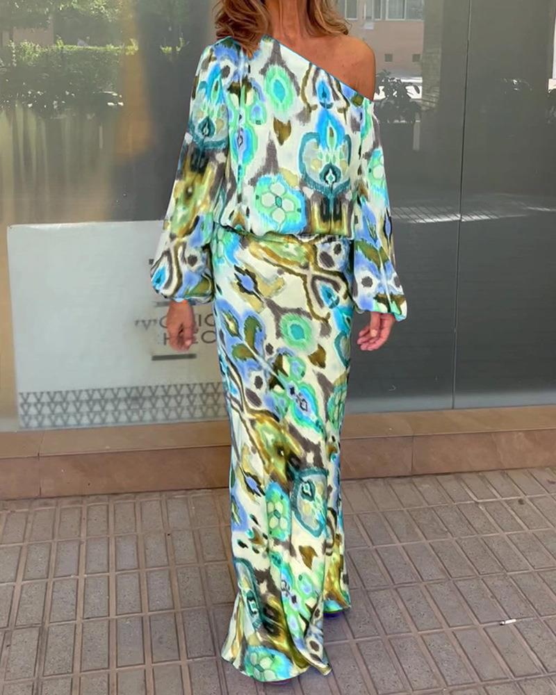 Women’s maxi dress with asymmetric one-shoulder, wide trumpet sleeves, and flowing satin print.