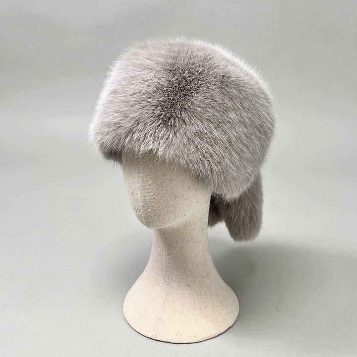 Women’s plush faux fur trapper hat with earflaps and decorative tail Mune Fashion