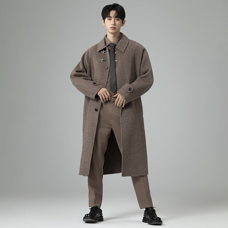 Men's floor-length wool blend coat in oversized cut with distinctive hook closures Mune Fashion