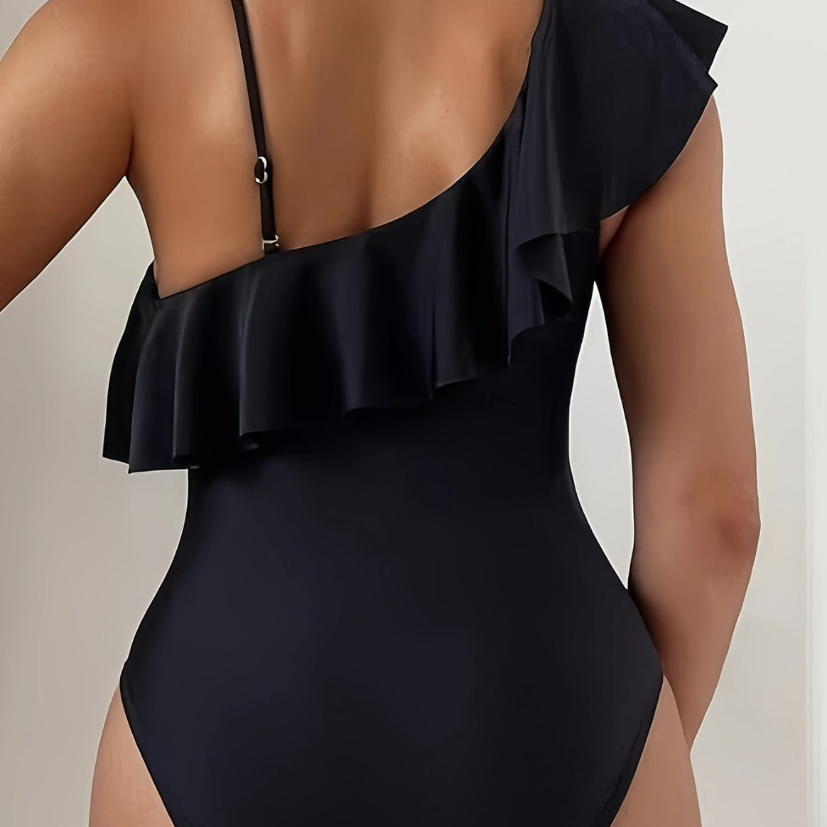 Women's one-piece swimsuit with asymmetric ruffle design and elegant cut-out details Mune Fashion