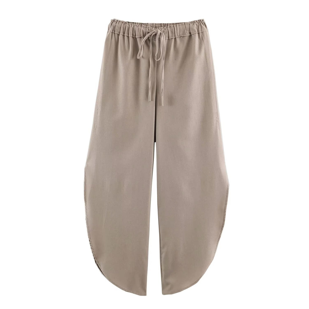 Ladies loose-fitting harem pants with drawstring waistband, mid-slit, and rounded hem Mune Fashion