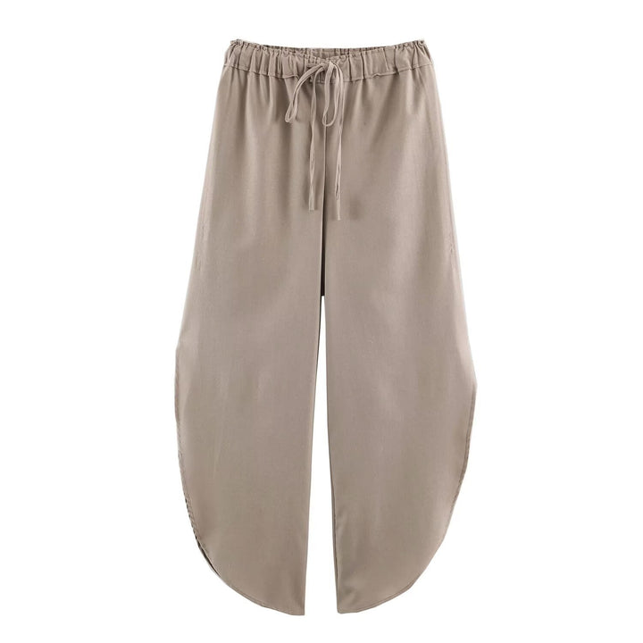 Ladies loose-fitting harem pants with drawstring waistband, mid-slit, and rounded hem Mune Fashion