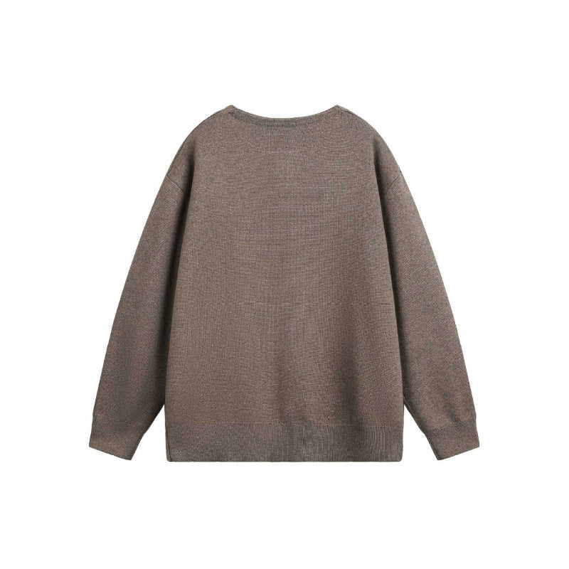 Unisex Oversize fine knit pullover with short Henley closure and structured mélange quality Mune Fashion