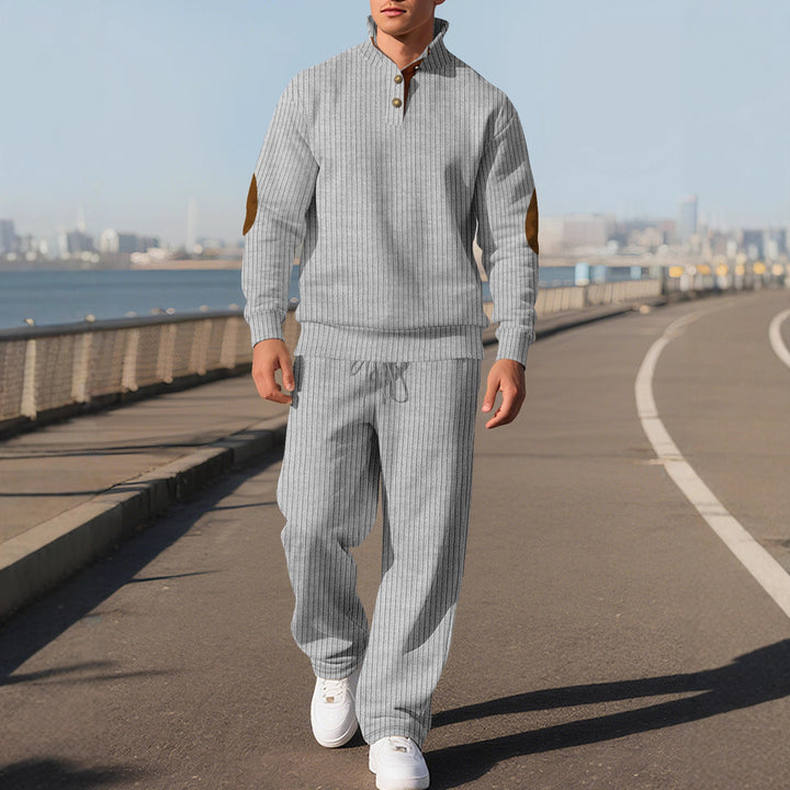 Men's fine ribbed sweater with half button placket, high stand-up collar, and contrasting suede elbow patches Mune Fashion