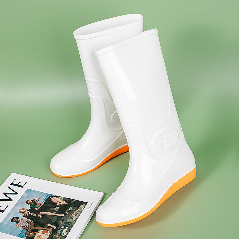 Women Shiny mid-height rain boots made of PVC with a lightweight wedge heel Mune Fashion