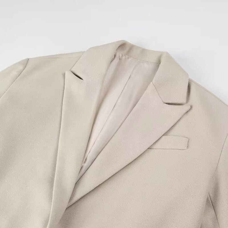Women’s long coat with long fringe hem, boxy oversized silhouette, and lapel collar Mune Fashion