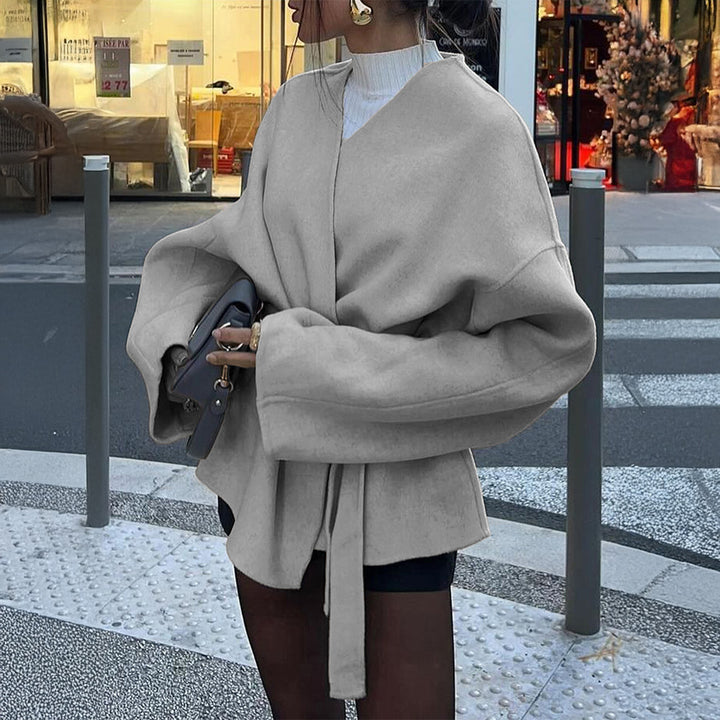 Women’s light wrap coat with tie belt, dropped sleeves and feminine waist emphasis Mune Fashion