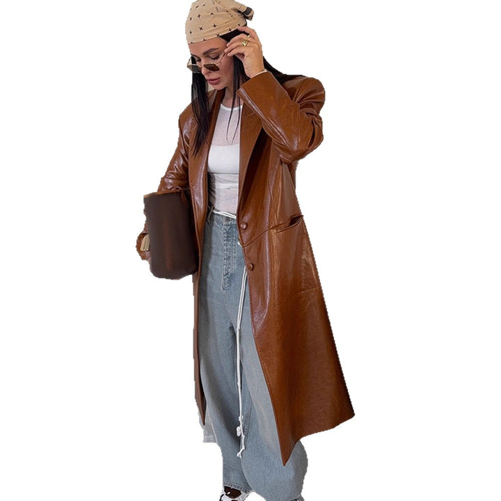Women's long-cut patent leather trench coat with lapel collar and boxy oversized fit Mune Fashion