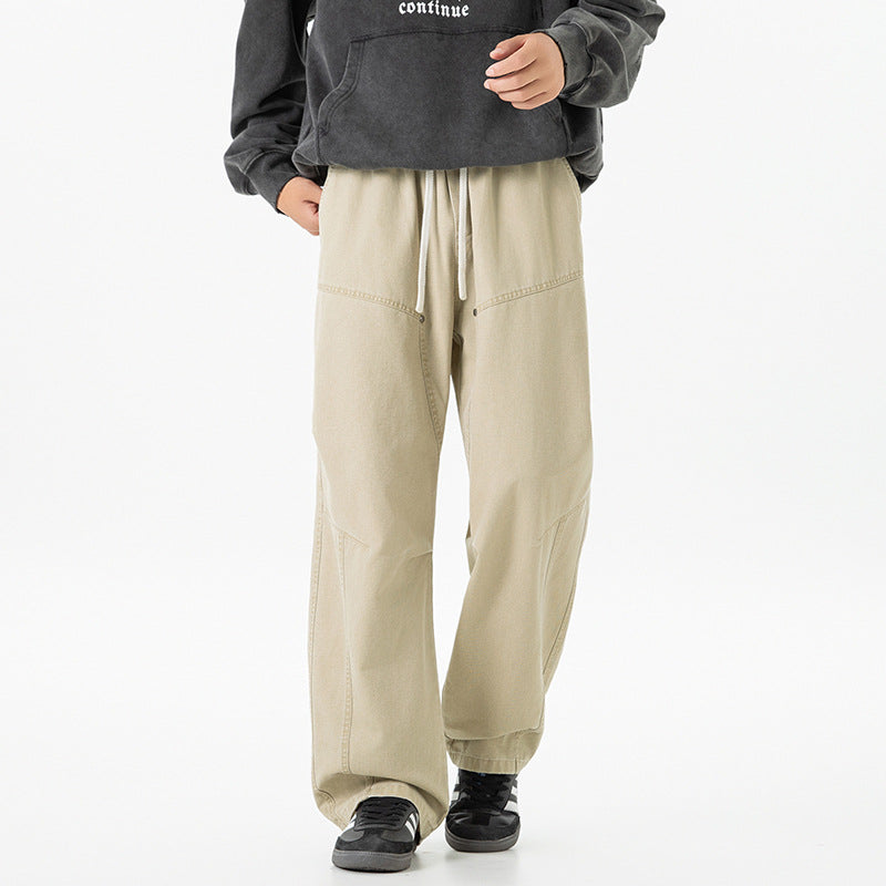 Men's wide baggy cargo pants made of washed canvas with elastic waistband and decorative stitching panels Drune