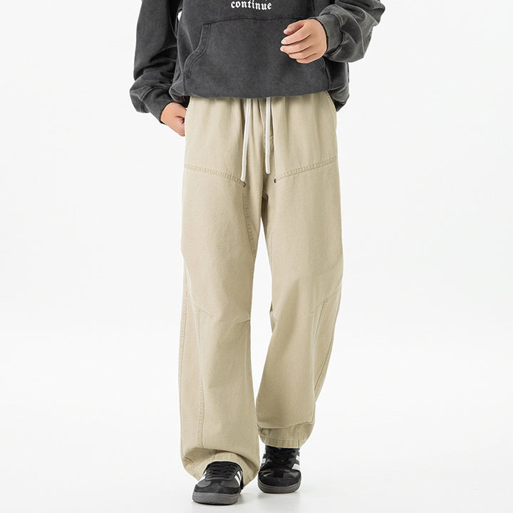 Men's wide baggy cargo pants made of washed canvas with elastic waistband and decorative stitching panels Drune