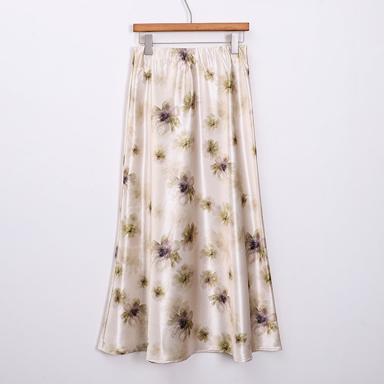 Women's elegant A-line midi skirt with watercolor floral print and fine satin look.