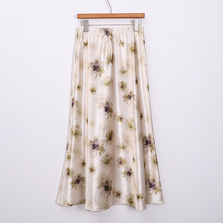 Women's elegant A-line midi skirt with watercolor floral print and fine satin look.
